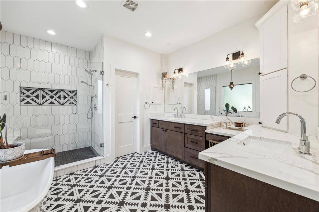 This room serves as a bright home office or workout space, featuring a large window with a garden view and can be utilized as a 4th first floor bedroom with a large walk-in closet.