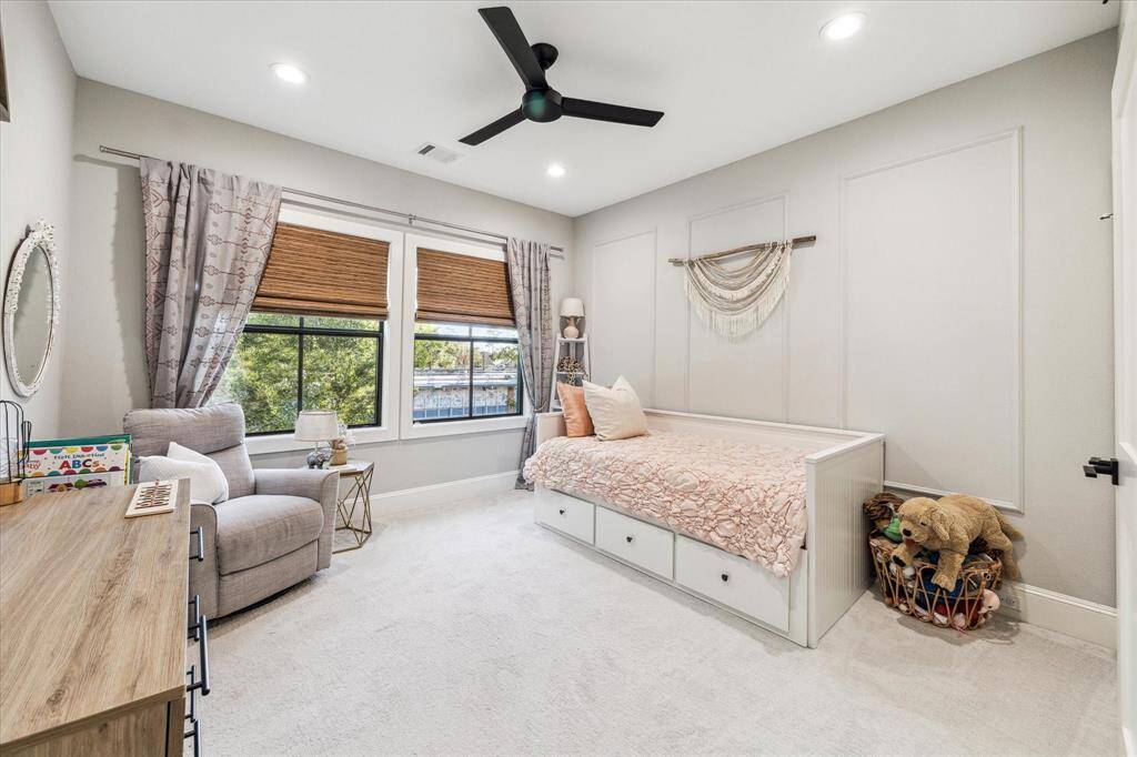 Large walk-in closet with custom built ins and an abundance of storage.