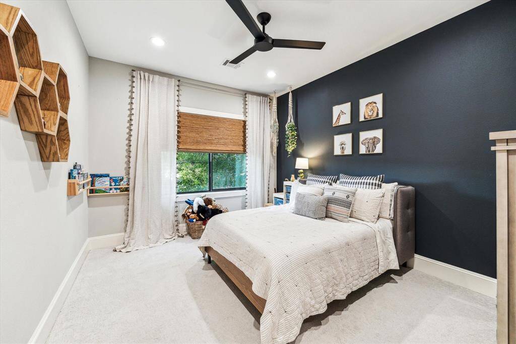 A flex space located at the upstairs landing area is currently being utilized as a playroom and offers a cozy, inviting atmosphere.