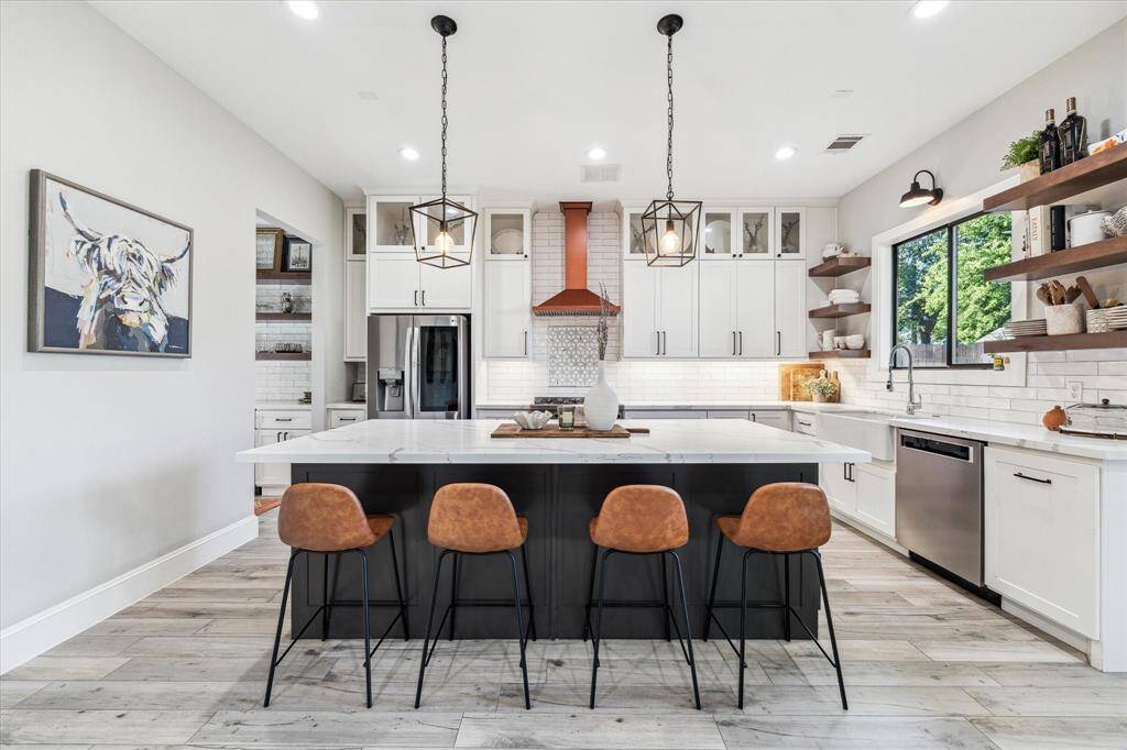 Upon entering the home, you are greeted by the formal dining room with space for a table seating of 6-8, perfect for entertaining.