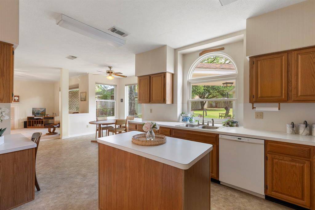The kitchen is bright with a neutral palette.