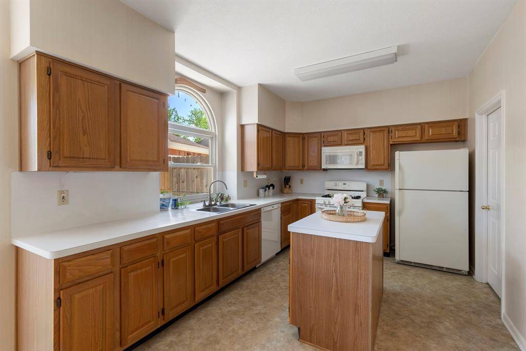 Abundant cabinets, island and counter space allow for all of your cooking and baking needs.