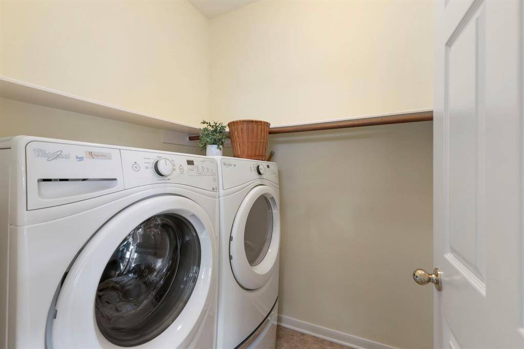 The laundry room is conveniently located on the first floor just off the kitchen with plentiful shelf space.