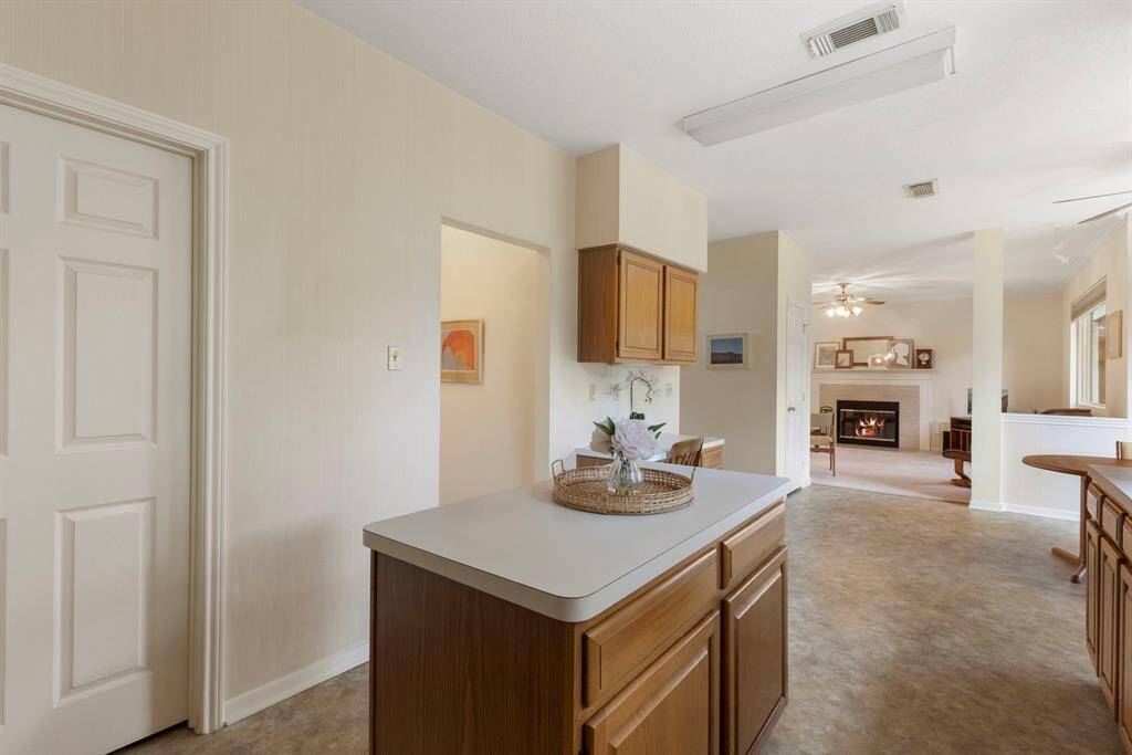 The kitchen is open to the dining area as well as to the family room, making entertaining and visiting easier.
