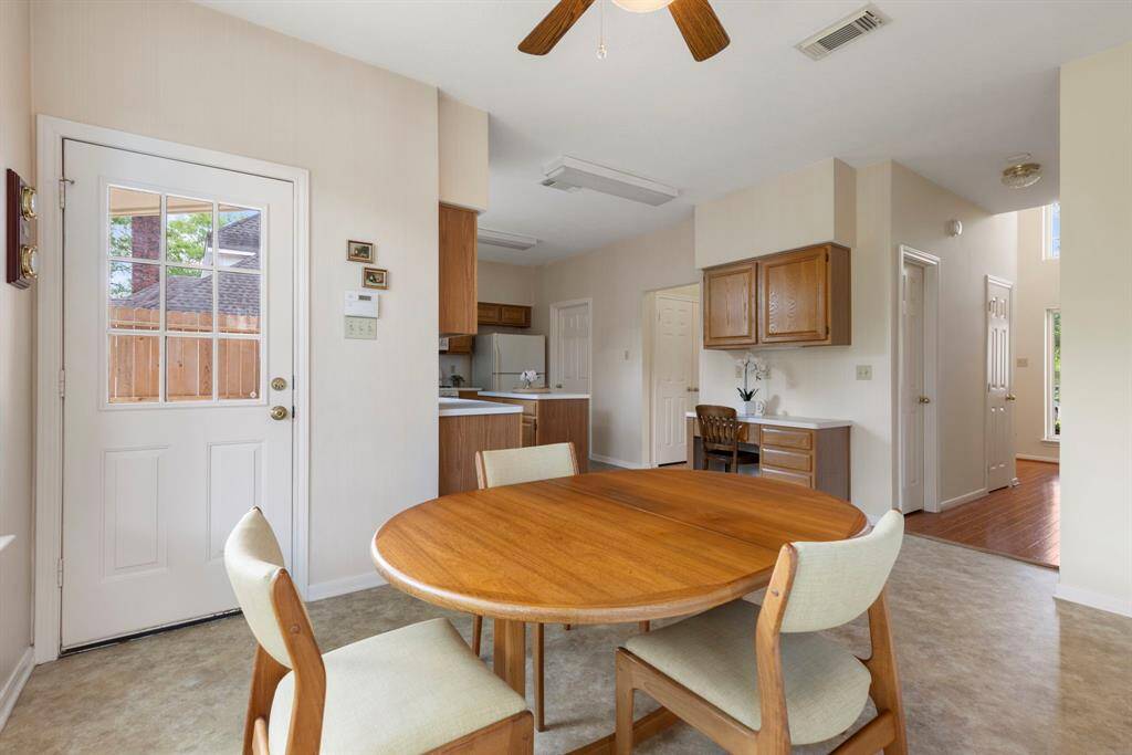 This space is large enough for dining for all, or a quiet morning coffee overlooking the birds, squirrels and butterflies in the park-like back yard.