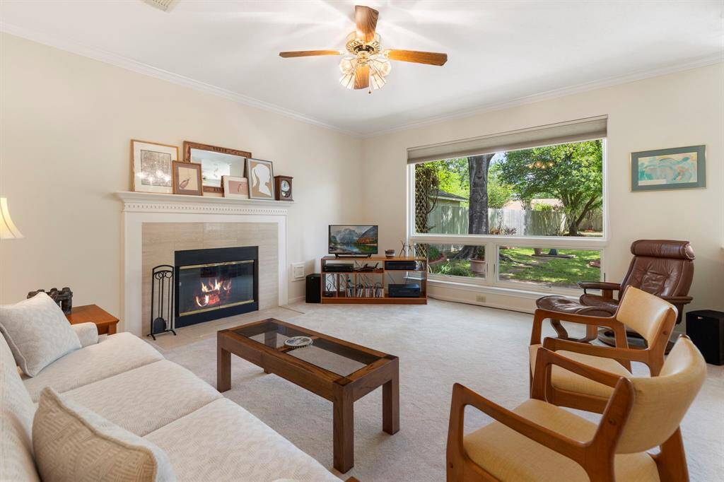 The family room features a cozy gas fireplace with beautiful wood moulding detail.