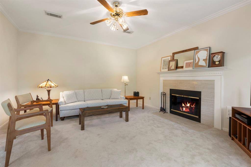 The family room features crown moulding and a neutral palette that will compliment any of your furnishings.