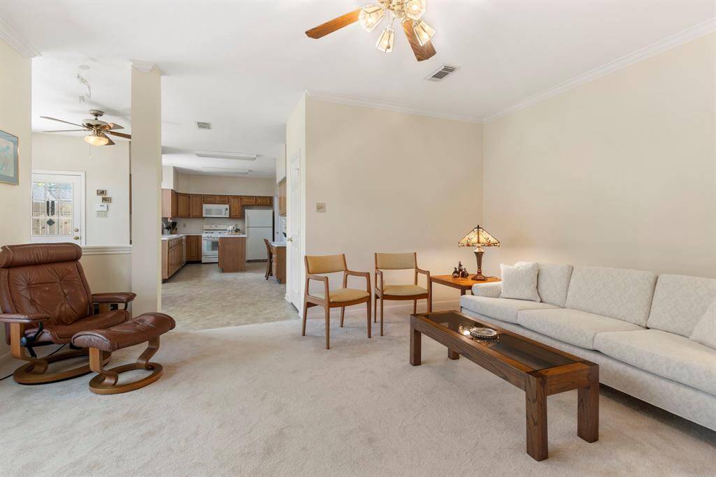 The family room overlooks the kitchen and dining area so you can easily visit with those preparing meals in the kitchen.