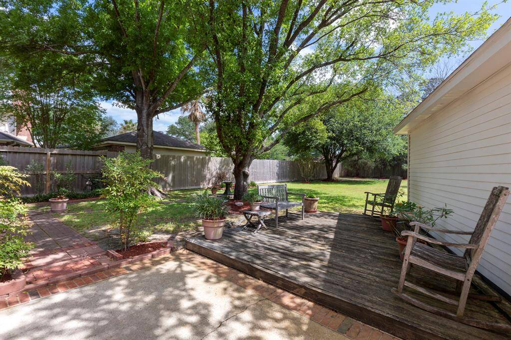 Rest and relax under the mature trees as you enjoy your private back yard.