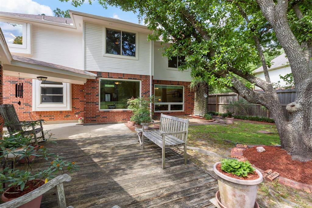 Another view of the patio area as well as the newly painted exterior and quality Andersen windows that provide plentiful natural light in the home.