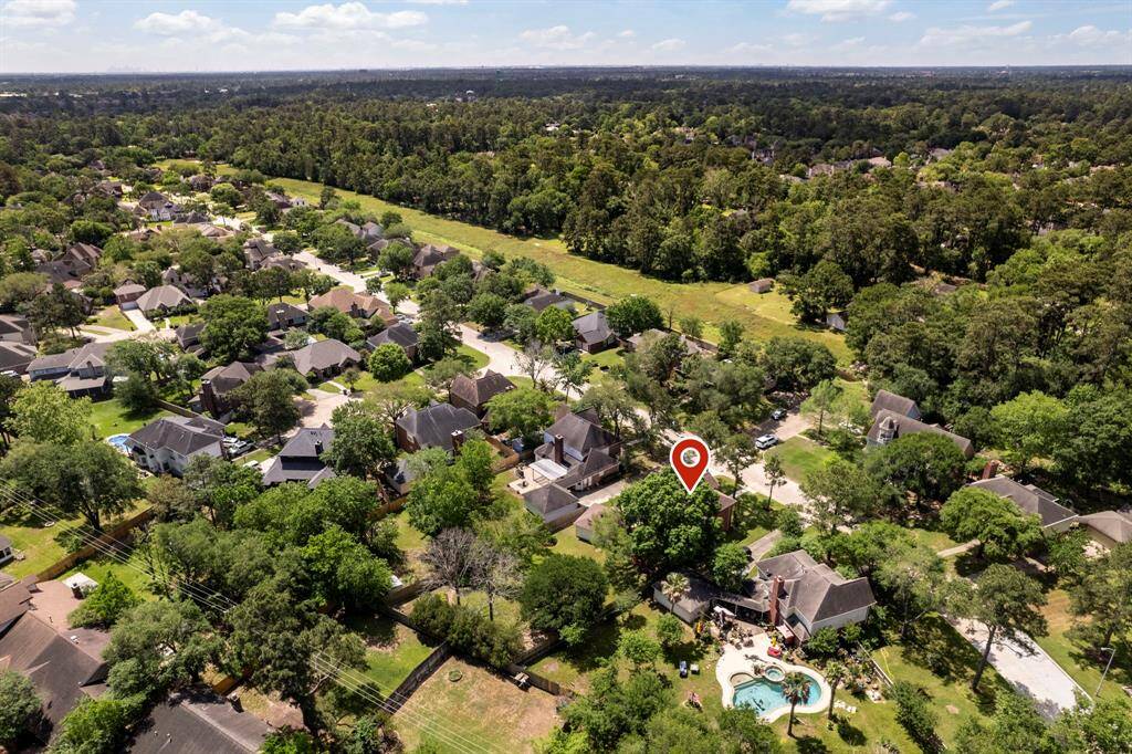 The area is beautiful with mature trees and green space.
