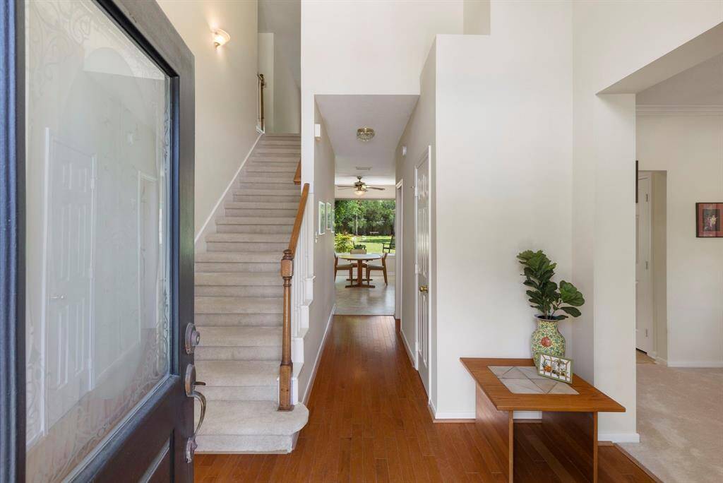 As you enter, you are welcomed by warm wood floors, newer paint and carpet and abundant natural light.