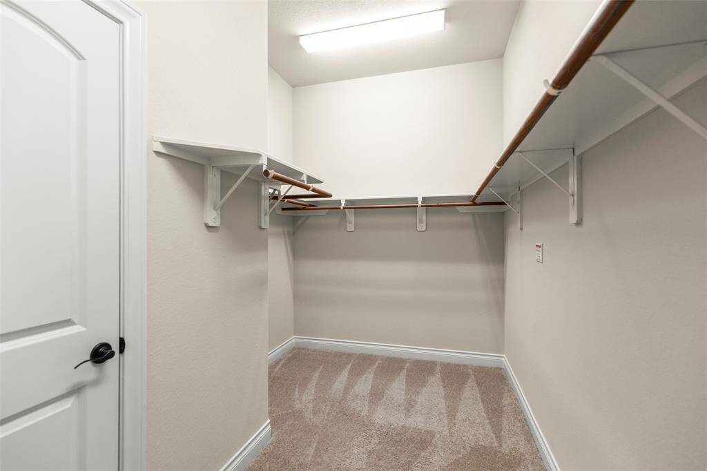 Huge Walk-in Closet with Hanging Shelves