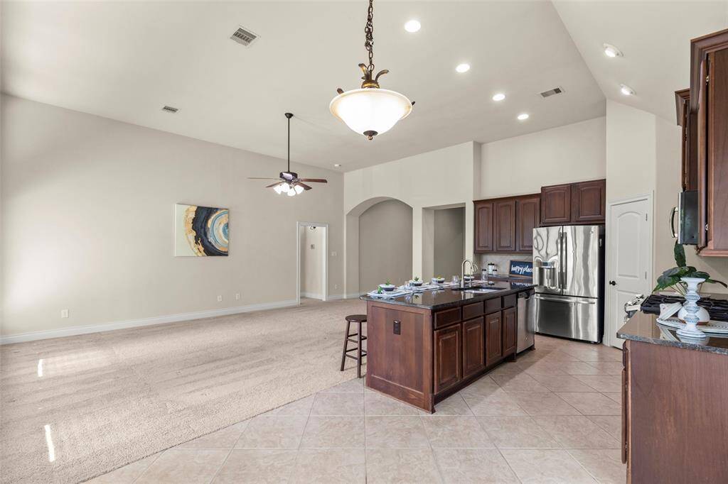 Great Living Room Area Features Ample Natural Light in this Open Floor Plan