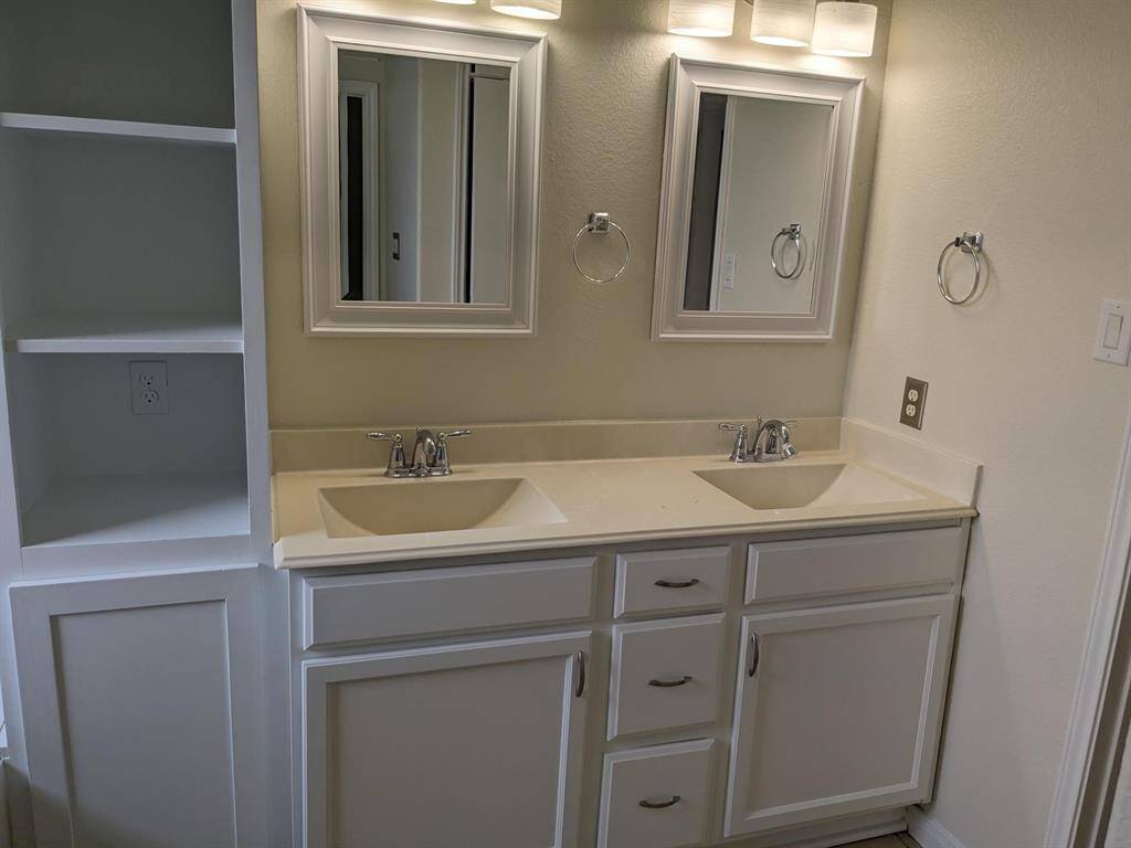 En suite Bath boasts dual vanities . . .