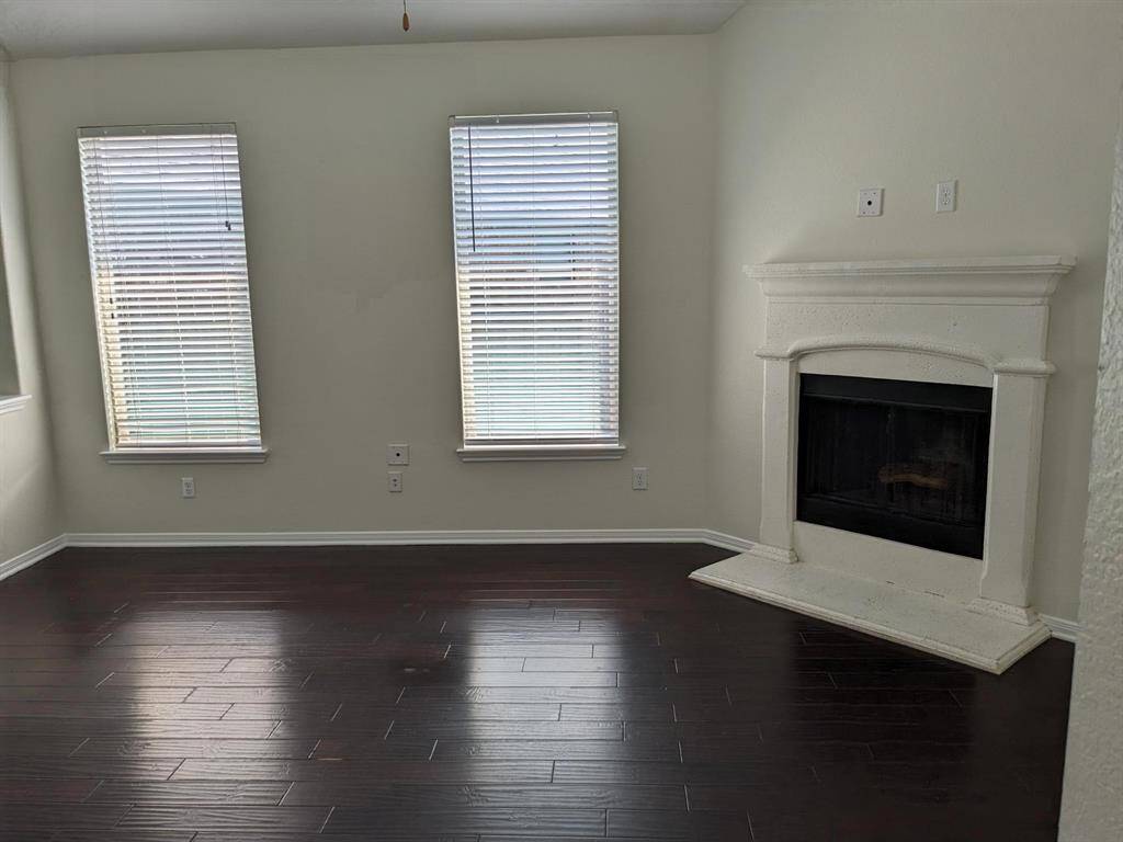 Beautiful wood floors continue into the Family room with Fireplace