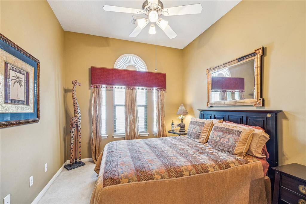 Second bedroom with ceiling fan.