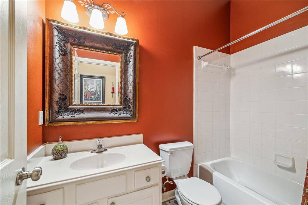 Second bathroom with custom mirror.