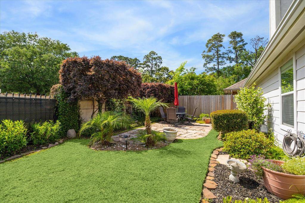 Spacious backyard professionally landscaped.