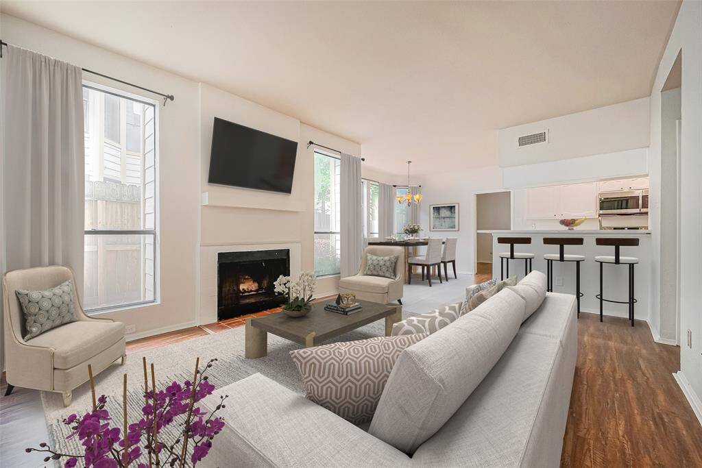 Experience the inviting charm of this home, virtually staged to highlight its cozy atmosphere and seamless flow into the kitchen and dining area. New 2 inch blinds are being installed.