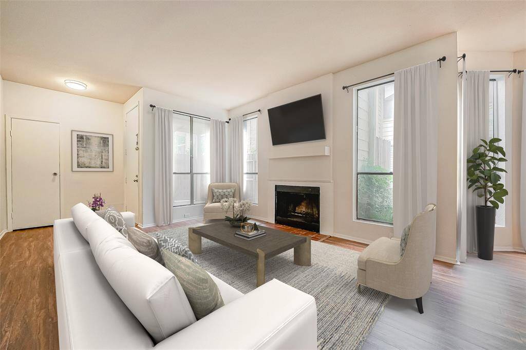 Check out this charming coat closet right by the front door—perfect for keeping your space organized and providing that extra storage you need!. Virtually staged