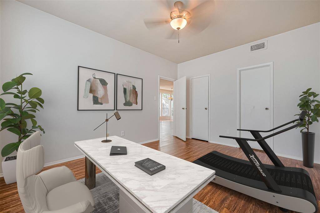 The first bedroom has been creatively staged as a stylish office, showcasing its versatility. However, this spacious room is perfect for setting up a cozy roommate arrangement or a playful children's area!