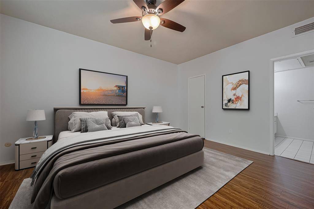 Experience the charm of the primary bedroom, featuring an elegantly updated ceiling fan, fresh paint, and a lovely view that invites you into the adjoining bathroom and spacious walk-in closet. It's a perfect blend of style and functionality!
