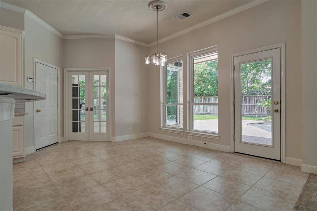 Note the built-ins, fireplace with mantel, and vaulted ceiling!
