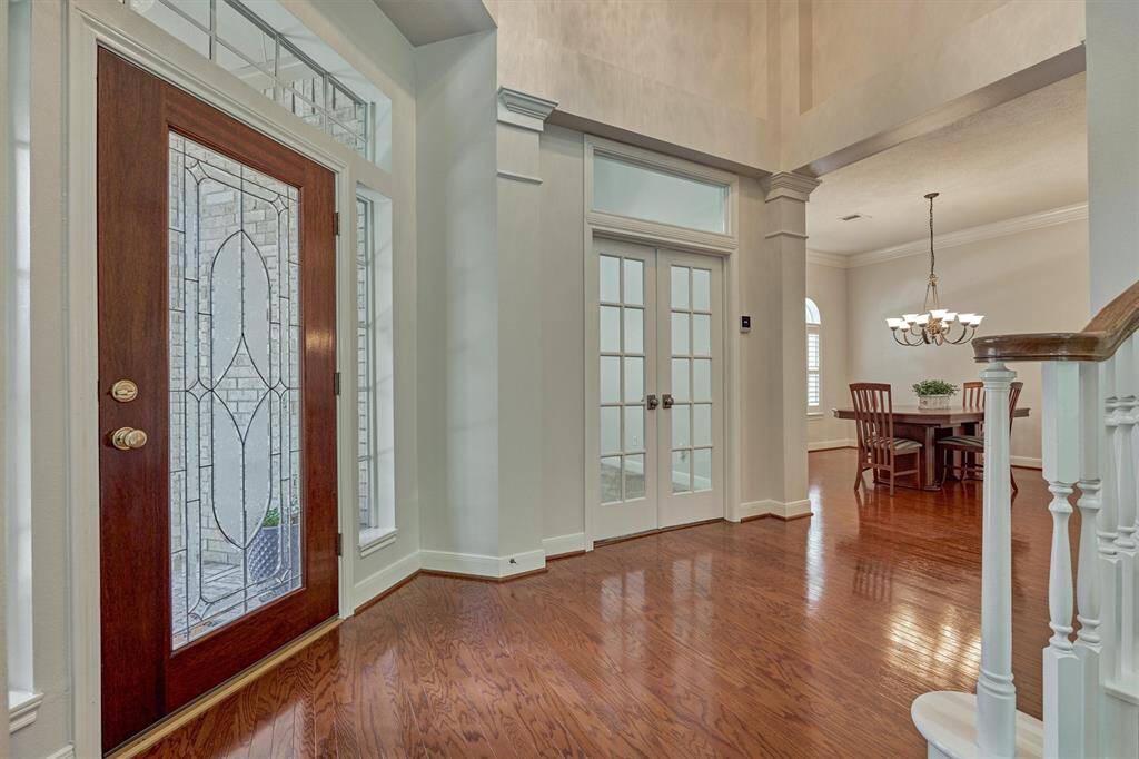 Unobstructed views to a picture-perfect setting, and note the passage way on right side to a private powder room, and secluded entry to the primary suite.