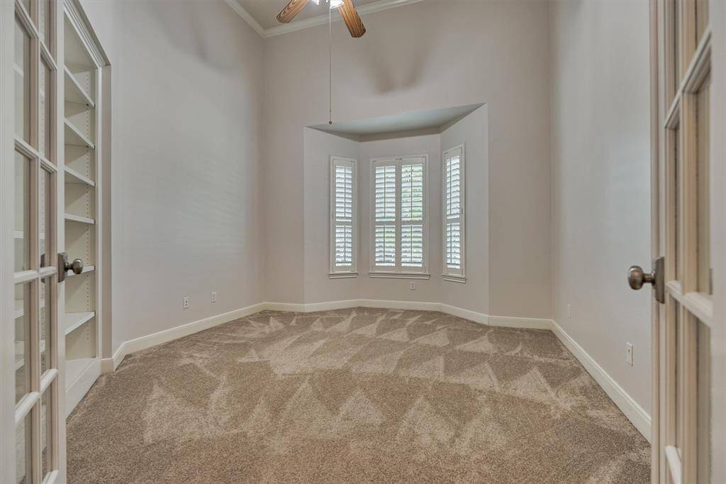 Secluded owner's retreat is plush and boasts incredible views of the private backyard oasis through expansive wall-to-wall windows!