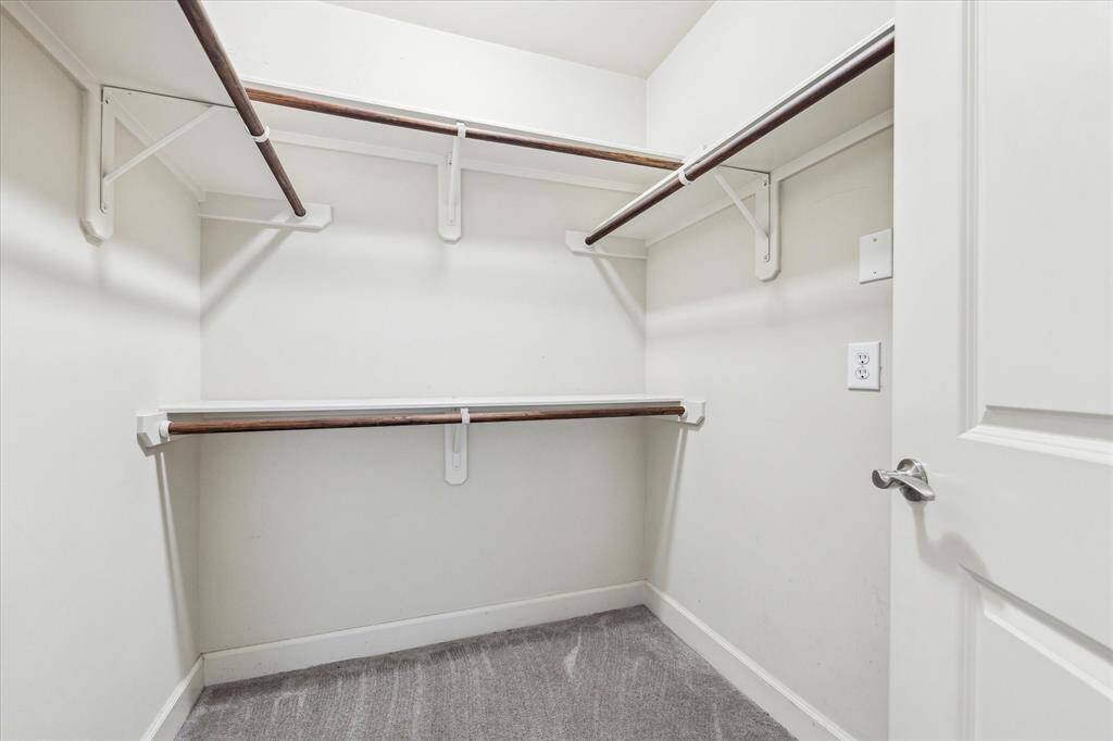 This generous walk-in closet in the primary suite offers abundant space for clothing, shoes, and accessories!