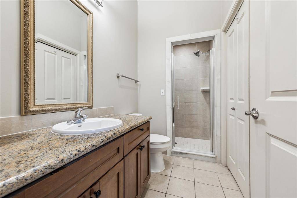 The secondary bathroom offers a clean, functional layout with all the essentials—perfect for guests or everyday use.