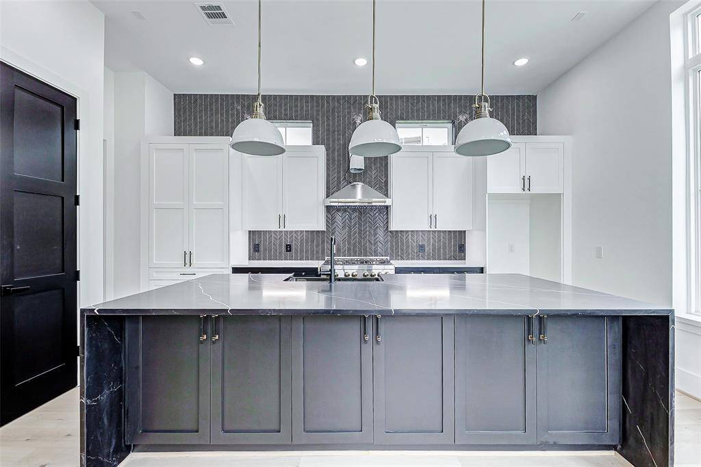Clean lines, modern finishes, and seamless functionality define this sophisticated space.