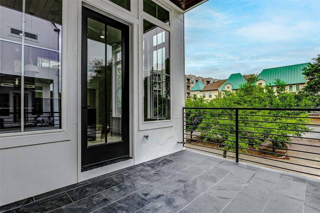 Step out onto the second-floor balcony and enjoy the outdoor retreat offering a peaceful escape while providing a front-row seat to the vibrant energy of the area. With ample space to relax or entertain, it's the perfect spot to take in the scenery and enjoy the surroundings.