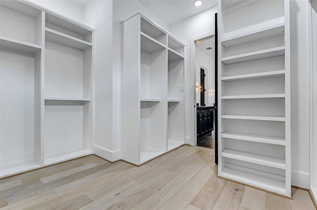 Thoughtfully designed to maximize storage, this closet provides ample space for clothing, shoes, and accessories, making everyday living effortlessly organized and luxurious.