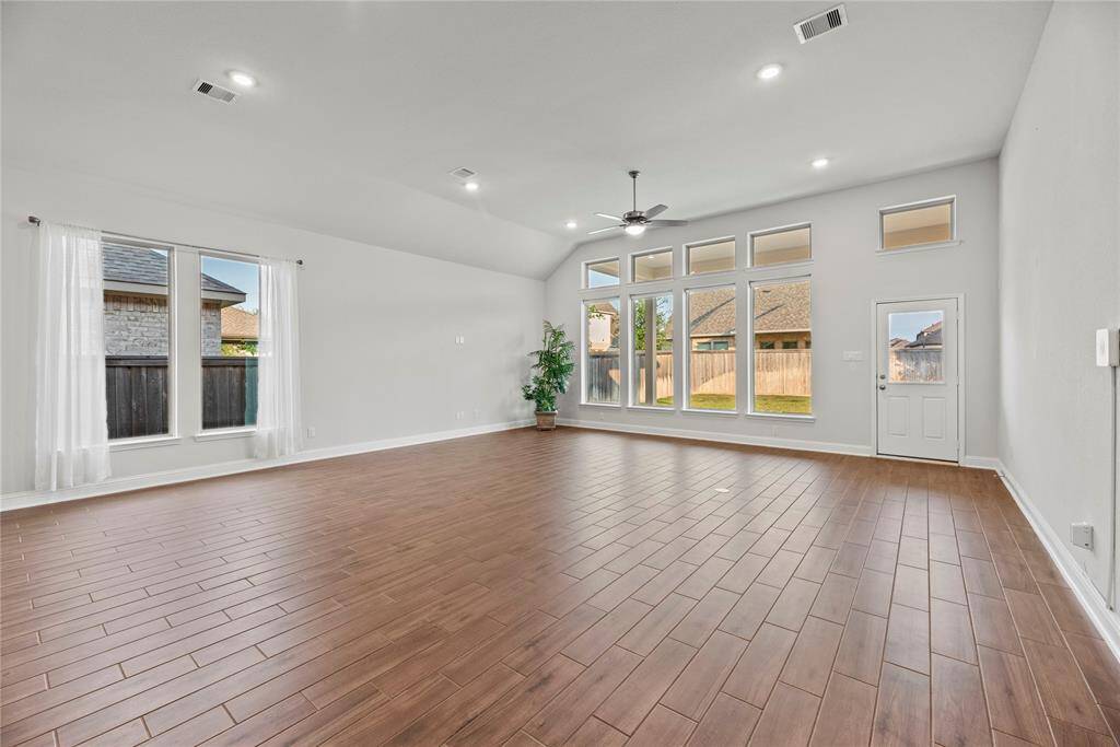Another view of the family room. A wall of windows provides natural light and backyard views.