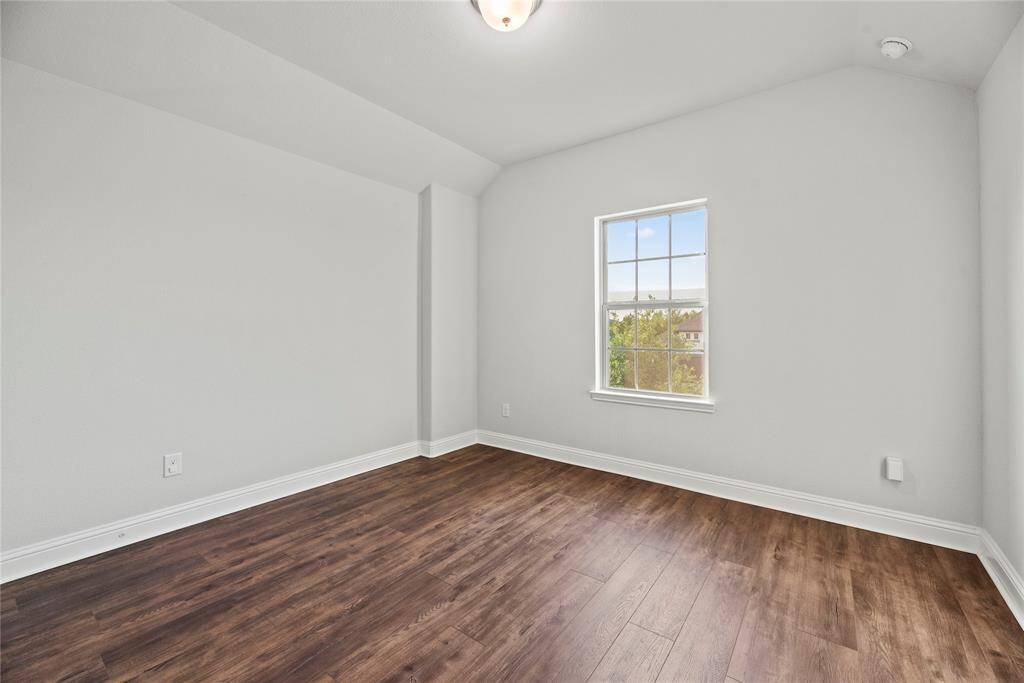 1 of 2 upstairs bedrooms. Both have walk-in closets.