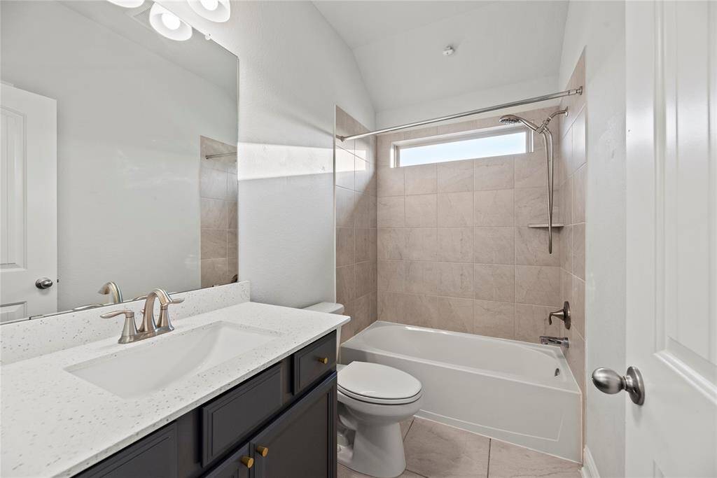 Full upstairs bathroom with a tub/shower combination.