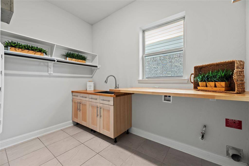 Beautiful utility room with a sink and built-in folding table.