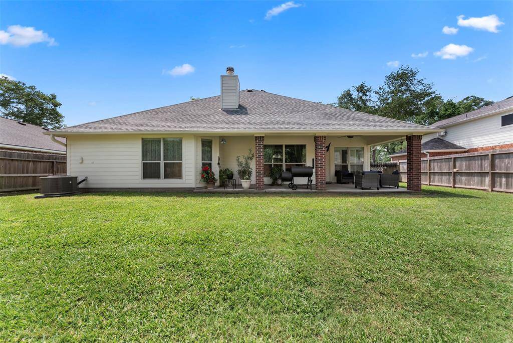 Another view of the back of your home with large covered patio