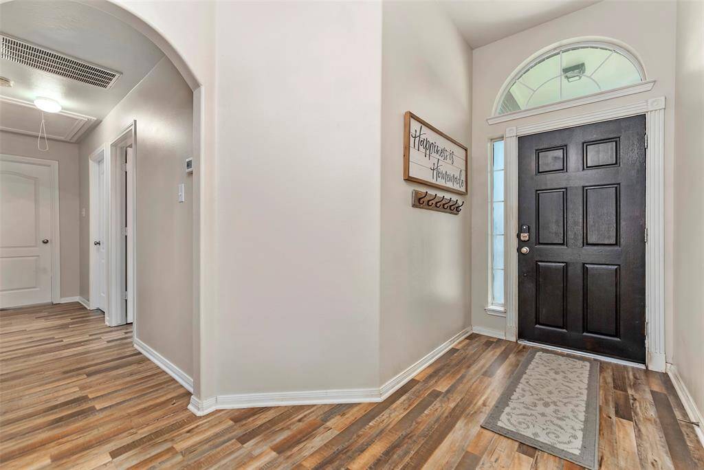 Entry and hallway to 3 bedrooms