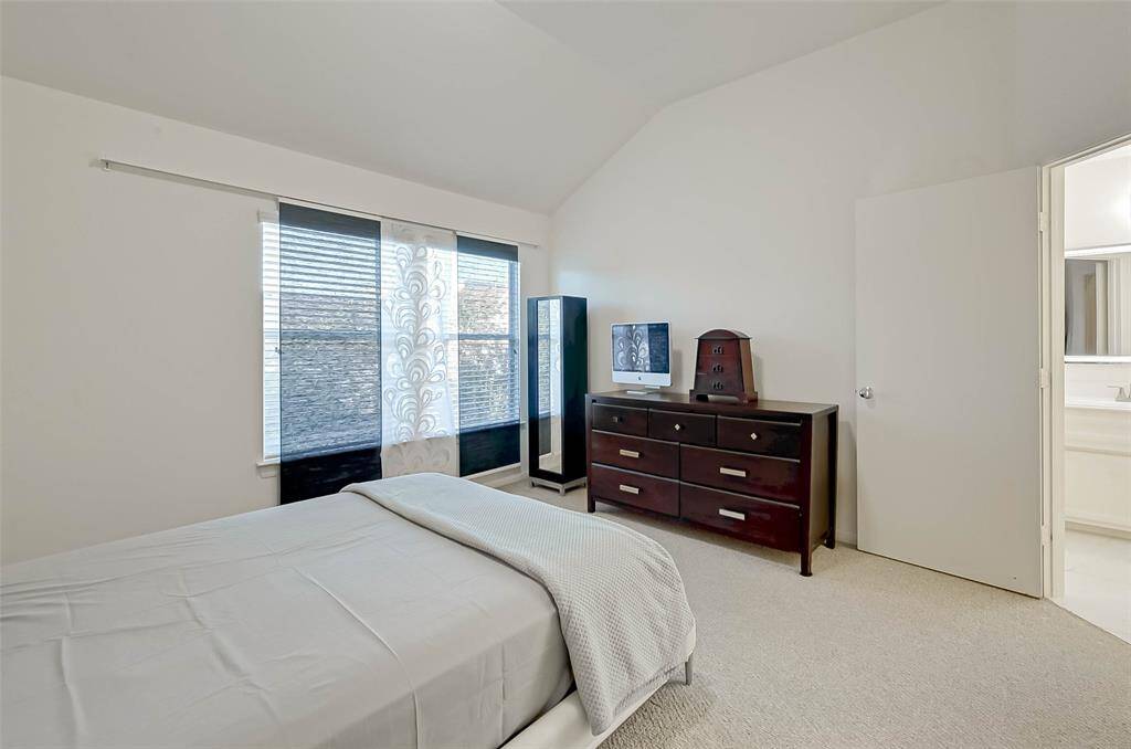 The third floor features the primary bedroom with en suite bath and large walk-in closet, utility room conveniently located next to primary bedroom with included washer and dryer,