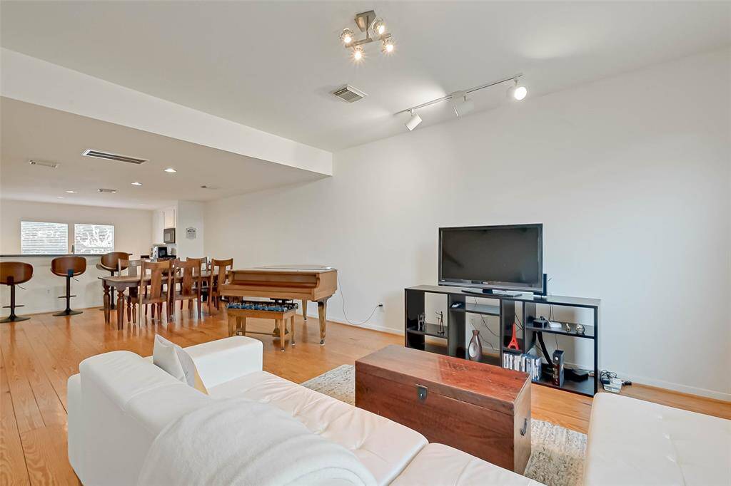 Pine hardwood floors, high ceilings, large open living & dining space.