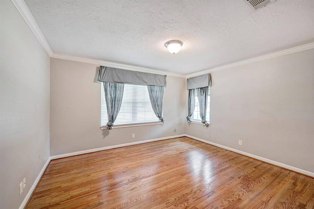 The secondary bedroom has wood floors, neutral paint & updated windows. Although some rooms face towards Chimney Rock the interior of the home is quiet.