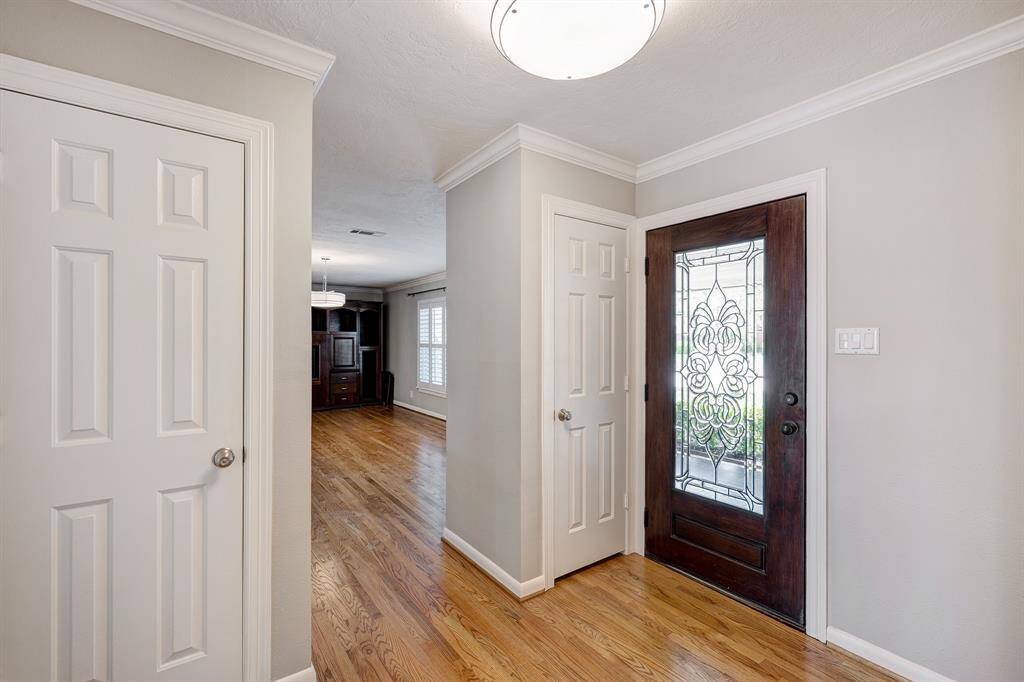 Enter the home through the exquisite leaded glass front door. The entry is a gracious size with 2 closets and opens to the front living area and den/family room.