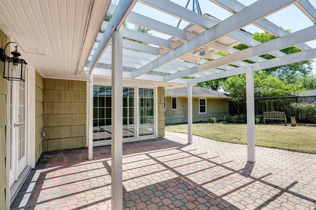 The arbor is wired to accommodate a fan/overhead light. Great place for outdoor dining, conveniently off of the kitchen.
