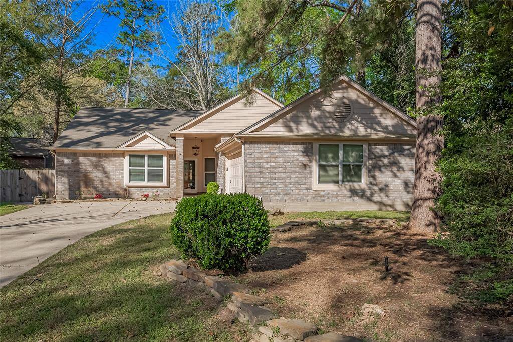Brick exterior on a large treed lot