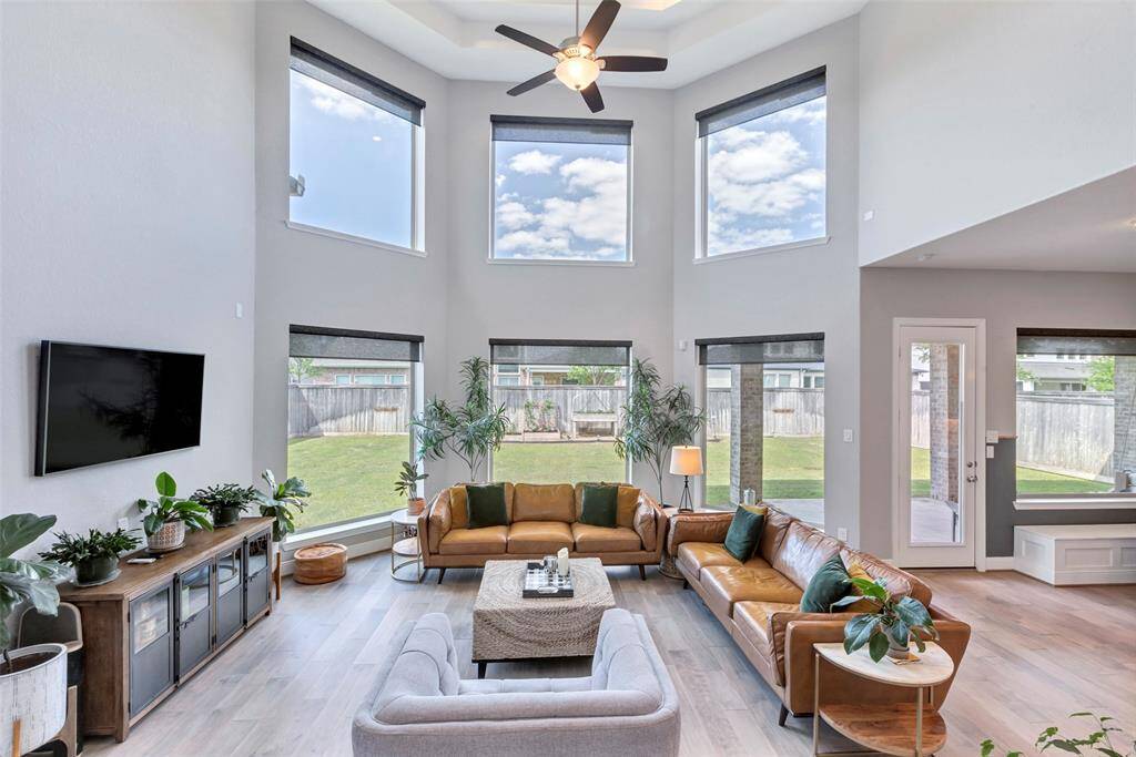 Soaring ceilings. Windows have solar powered custom shades