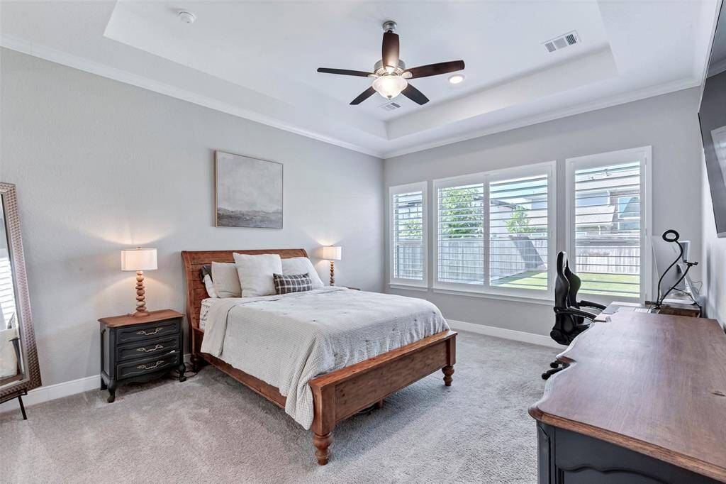 Primary bedroom with plantation shutters