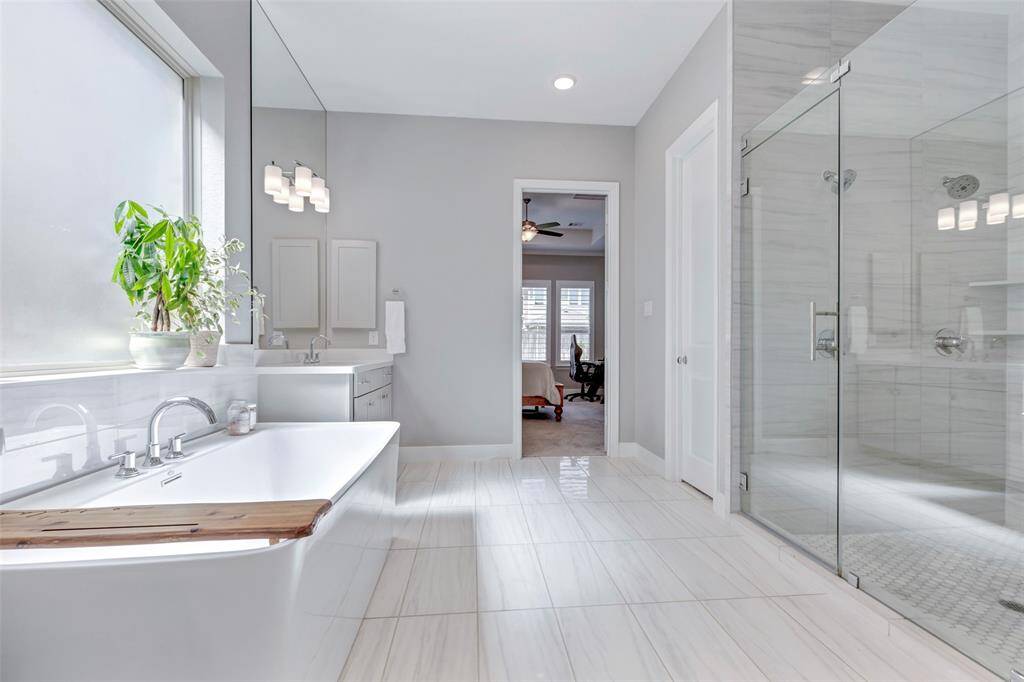 Oversized shower with double shower heads. Custom fitted his and her closets